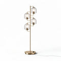 Gold floor lamp with four glass shades and a sleek design 150 x 40 x 40cm
